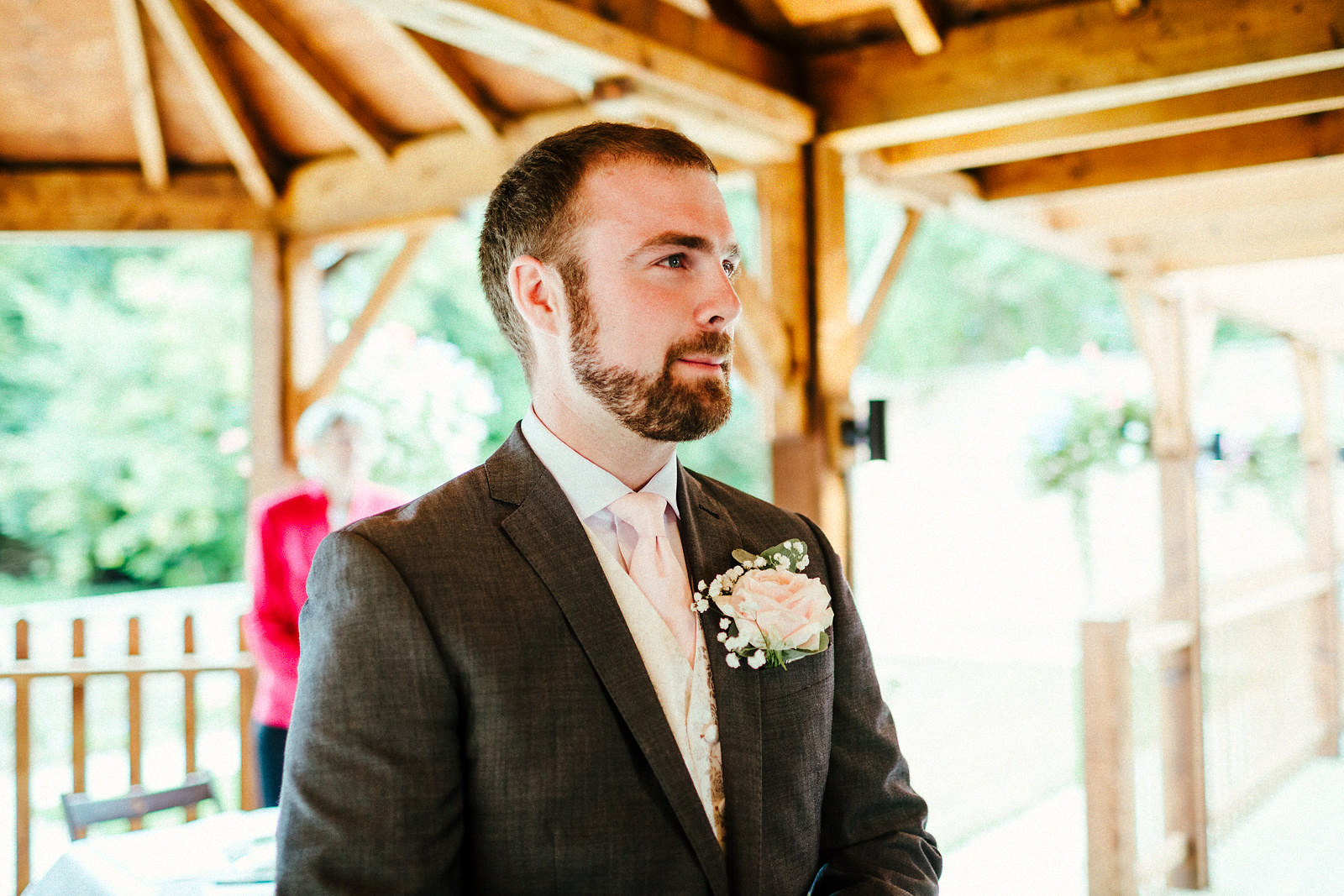 Groom waiting at Orchardleigh walled garden