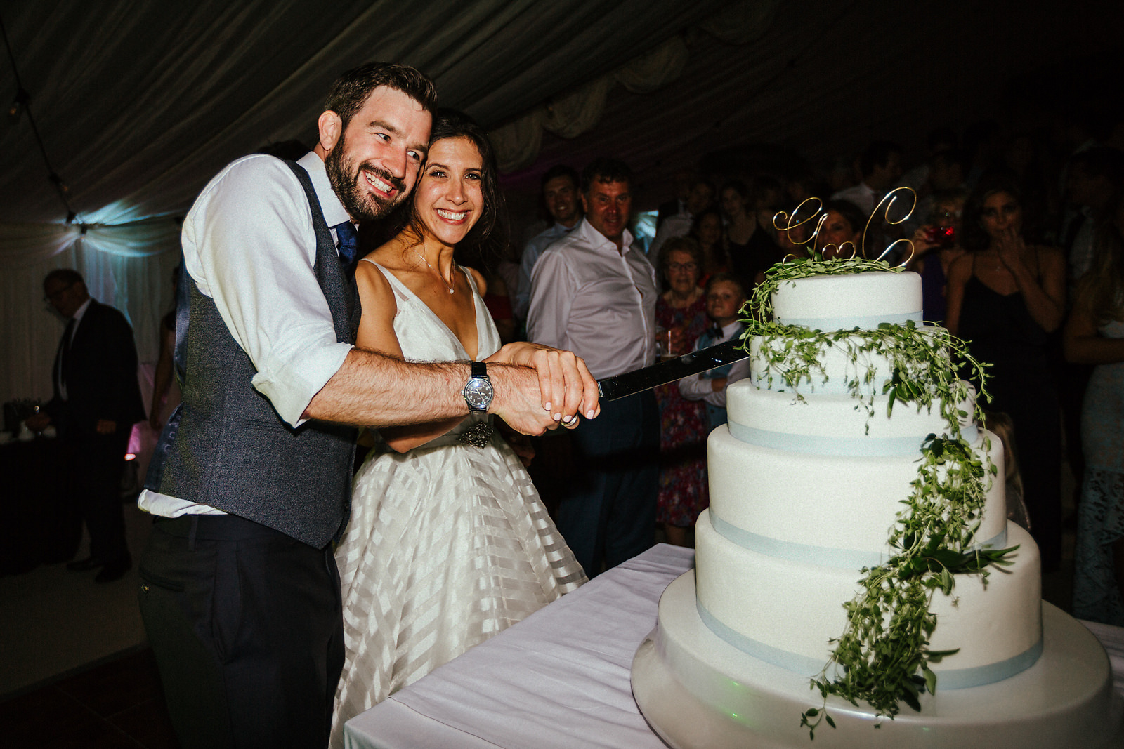 Cake cutting at Jewish wedding in Essex