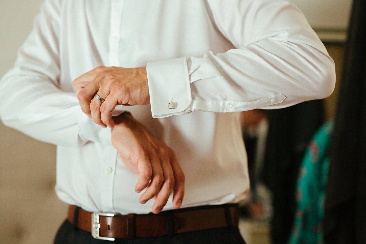 Groom getting ready at home for a wedding