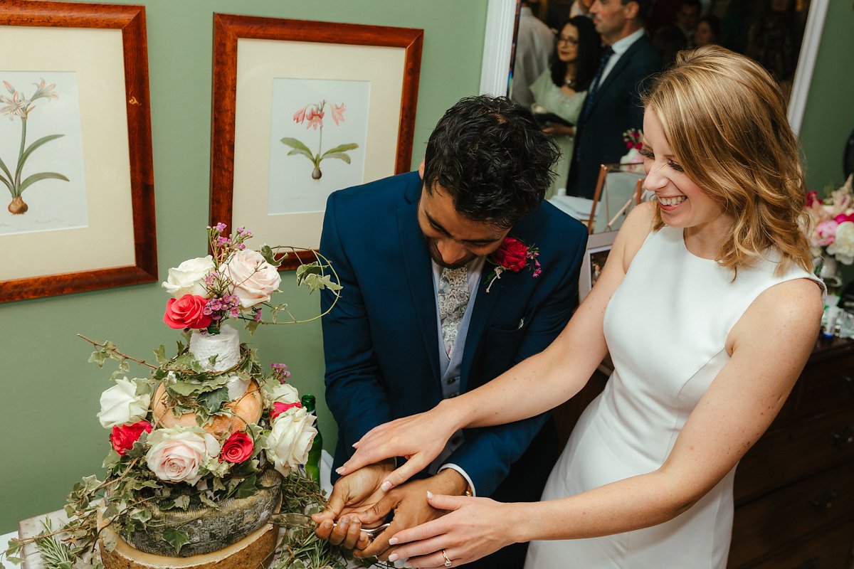 Bride and groom cutting the cake