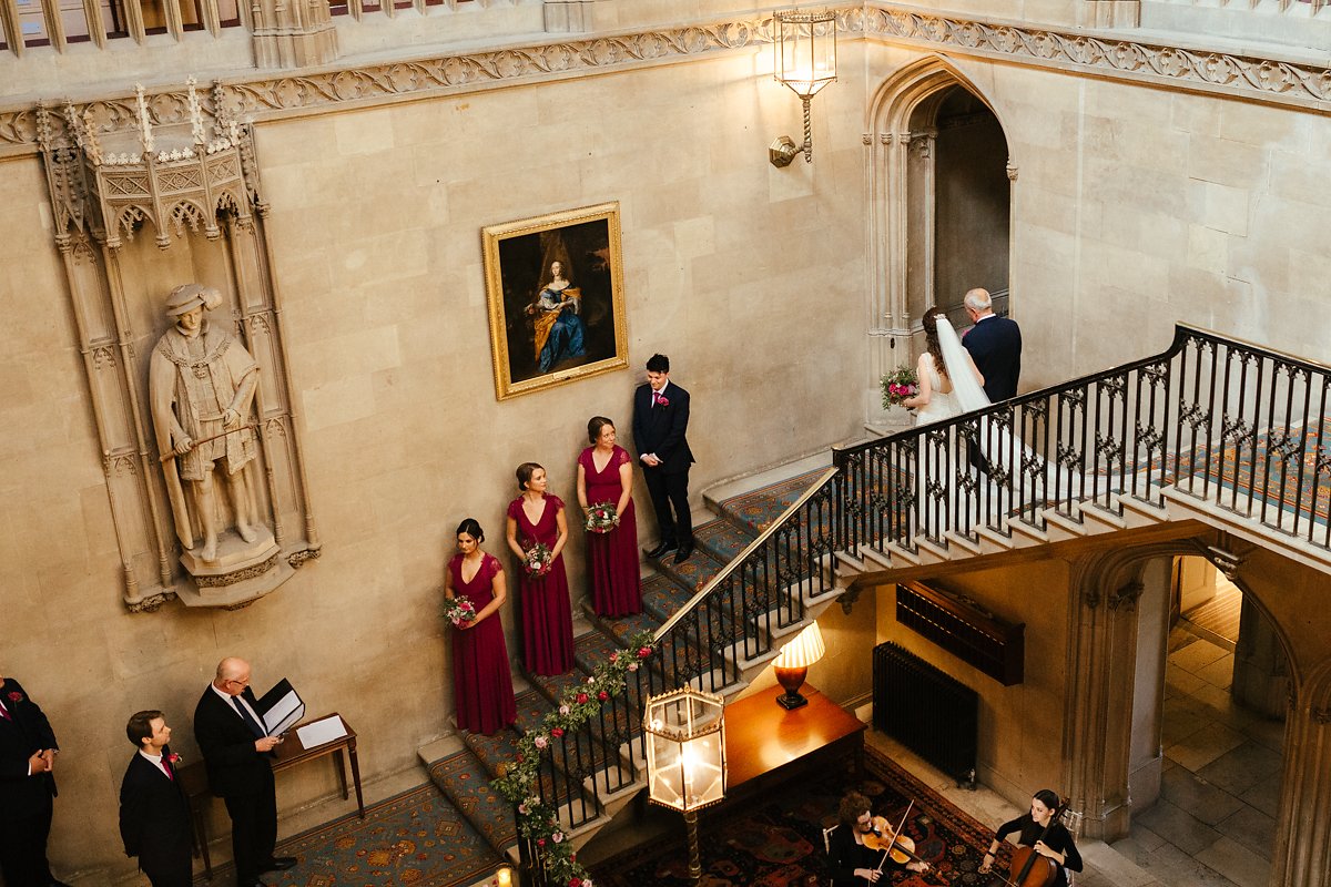 Wedding ceremony at the grand stairs at Ashridge House