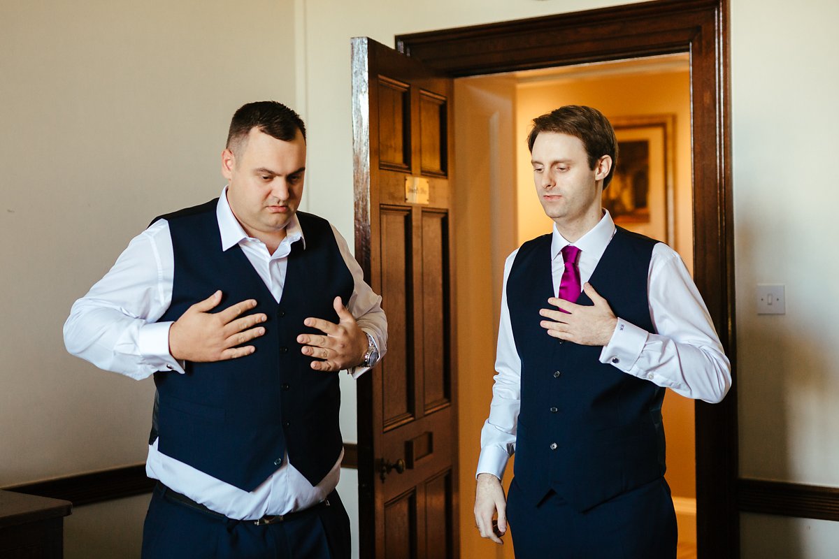 Groom getting ready with his brother at a country house