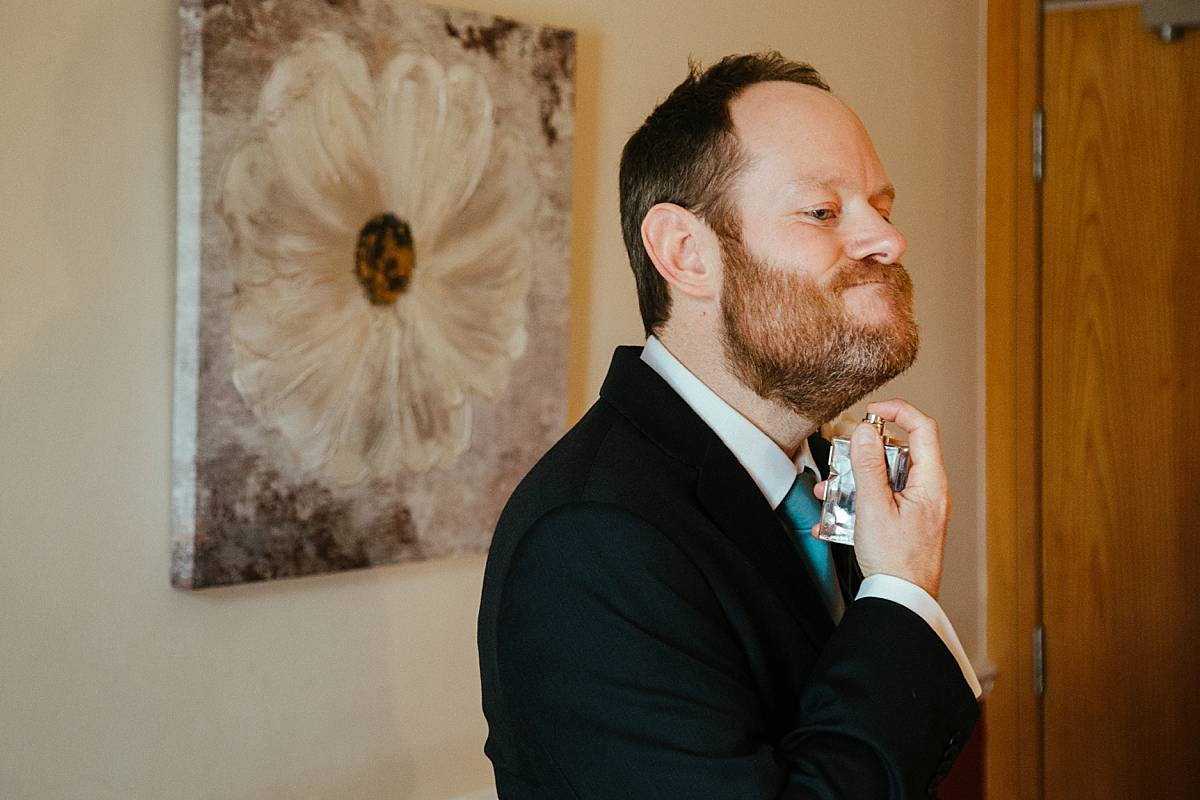 Groom getting ready at Missenden Abbey