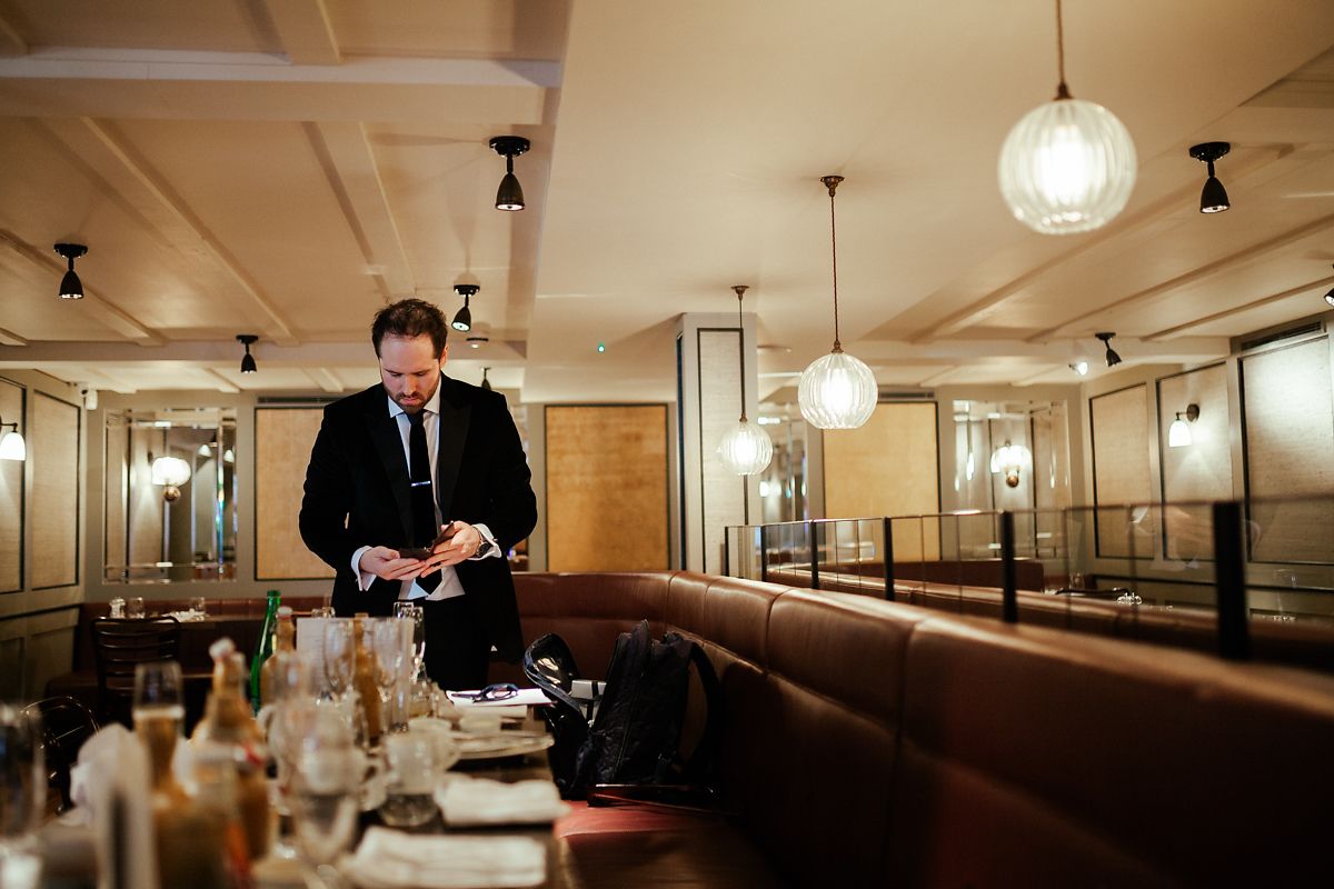 Groom getting ready at Cote Brasserie 