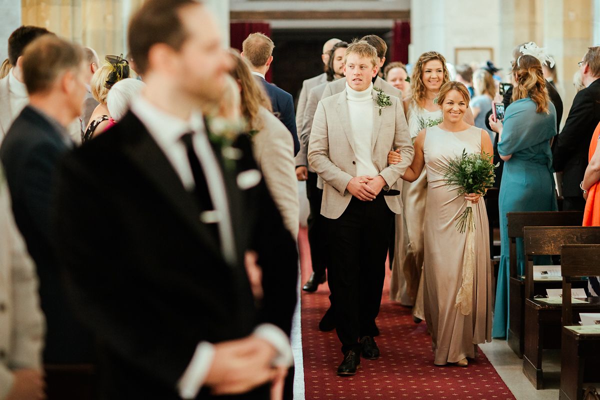 Bride walking down the aisles on right hand side