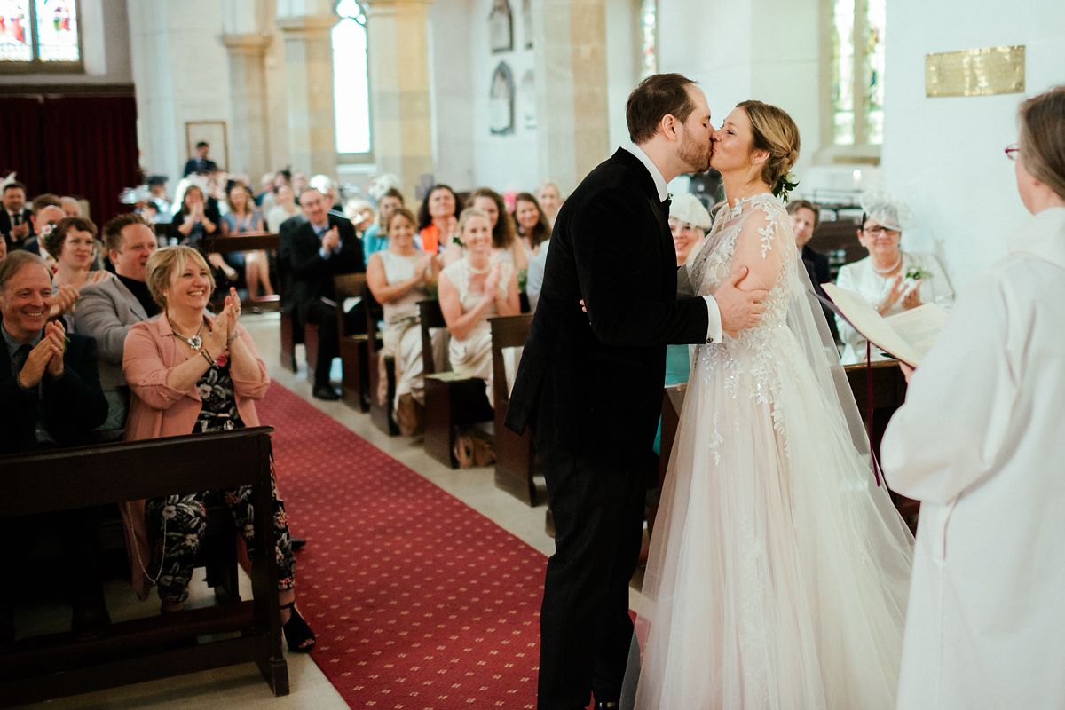 First kiss as newly married at St Mary's church in Old Amersham