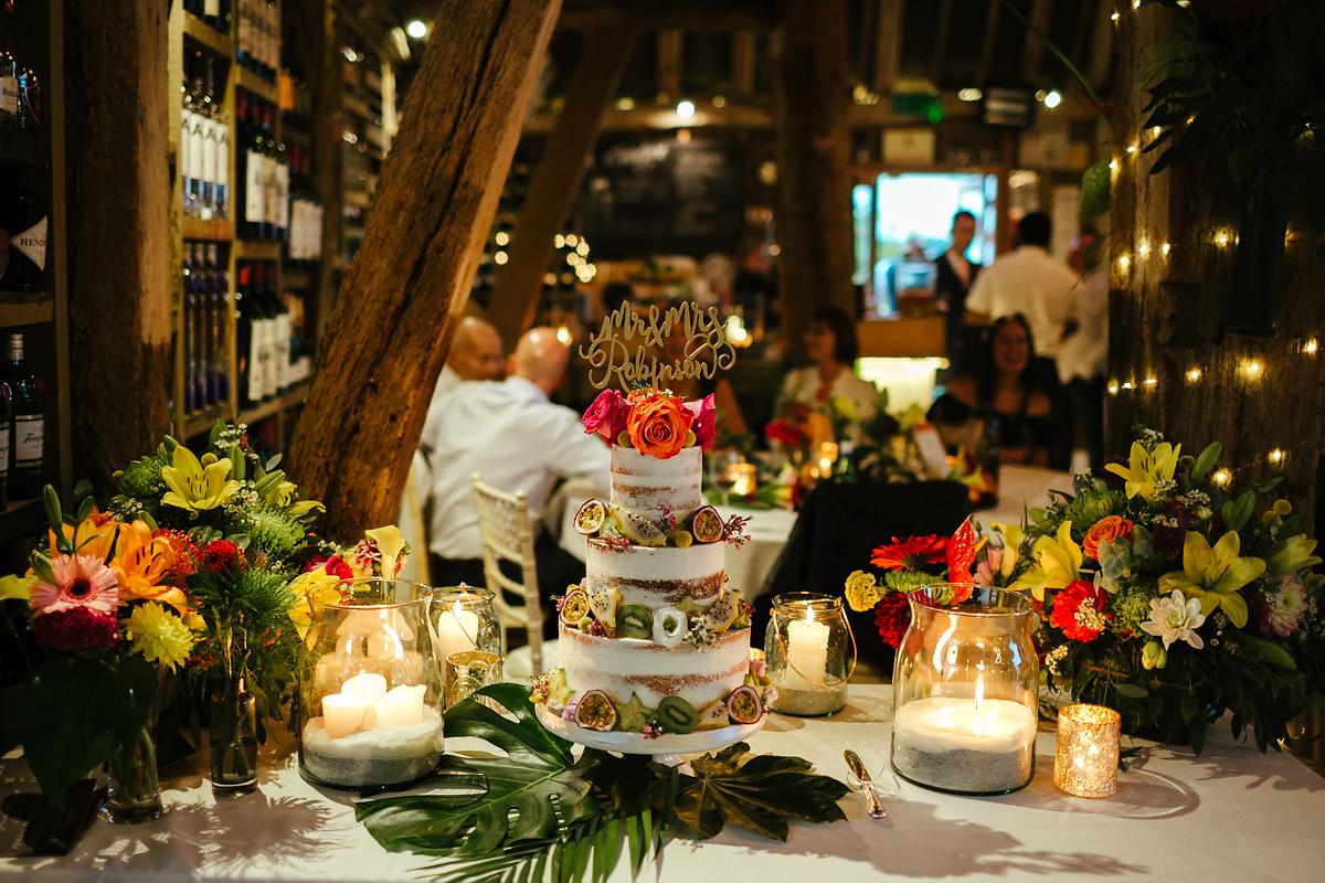 Wedding cake covered with exotic flowers