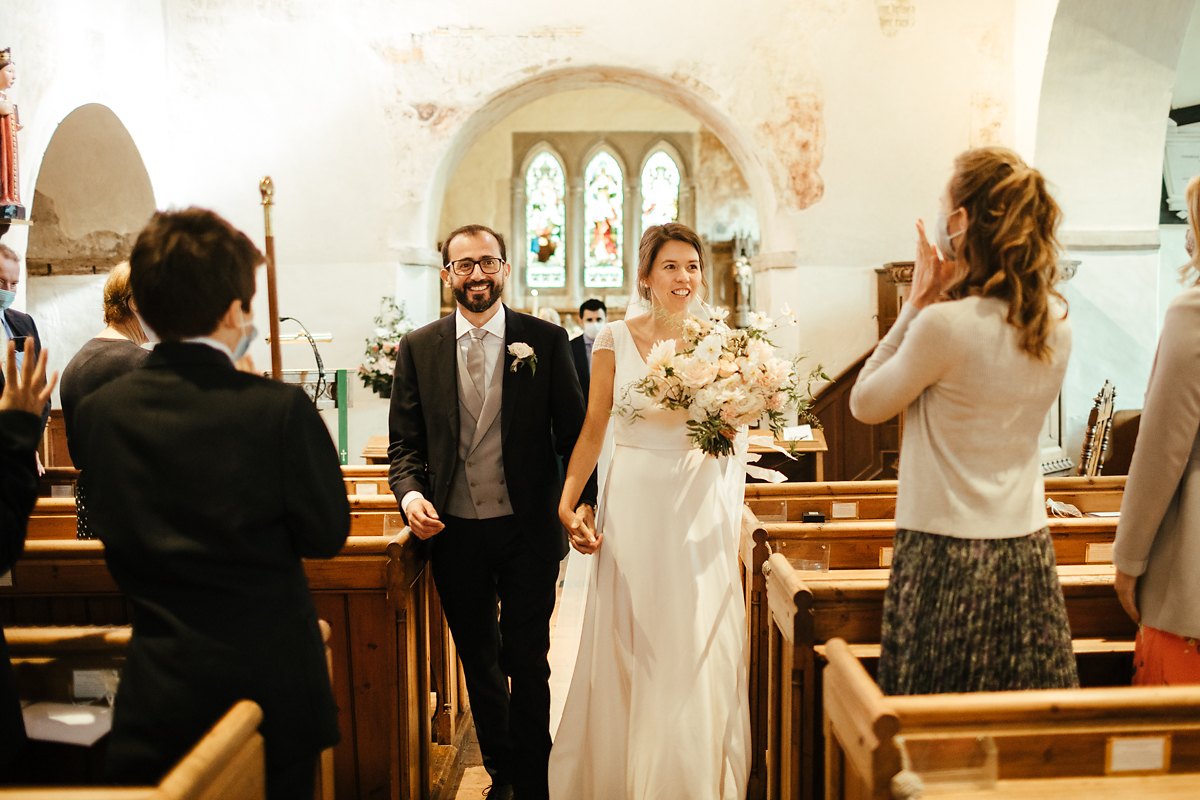 Bride and groom exiting church