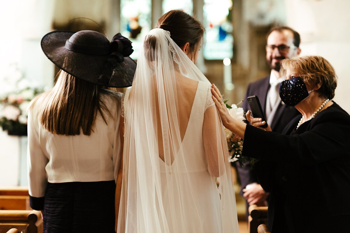 Bride walks down the aisle with her mum